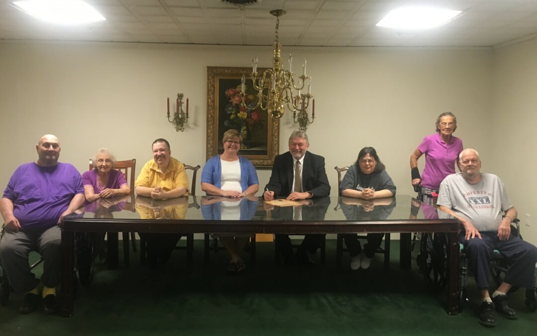 group photo: In picture from left are Jeffrey Shout, Fredna Cheek, Tim Blevins, Charlotte Roberts, Administrator Bourbon Heights, Judge Williams, Tracy Moore, Dottie Hillock (standing), Billy Hays.